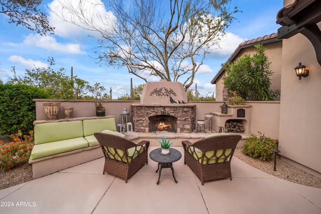 view of patio / terrace featuring an outdoor living space with a fireplace