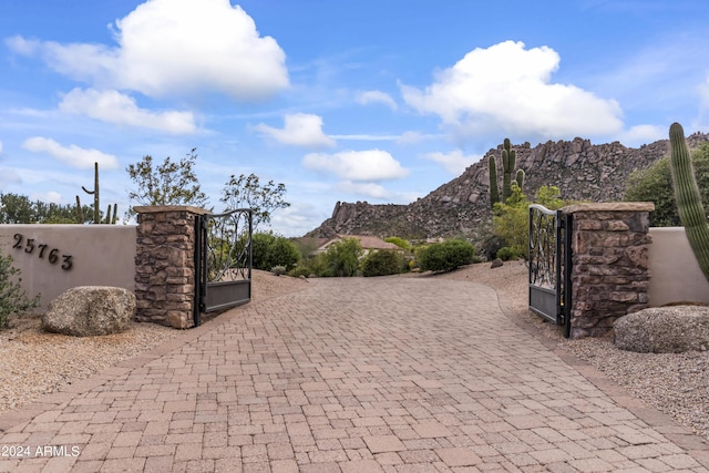 view of gate featuring a mountain view