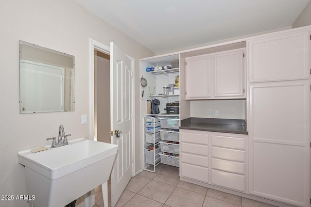 bathroom with tile patterned floors and sink