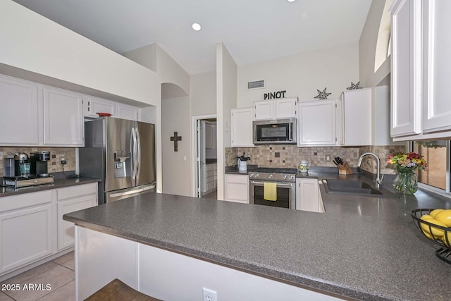 kitchen with white cabinetry and stainless steel appliances