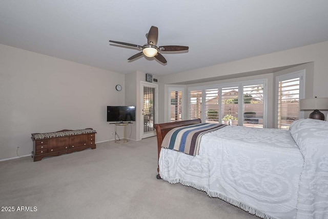 bedroom featuring light carpet and ceiling fan