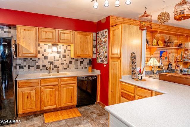 kitchen with backsplash, sink, and black appliances