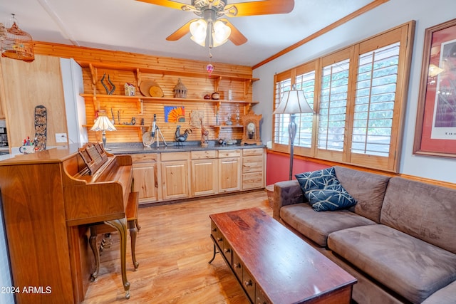 living room with ceiling fan, light hardwood / wood-style flooring, and ornamental molding