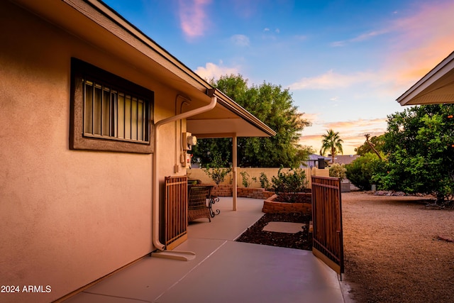 view of patio terrace at dusk