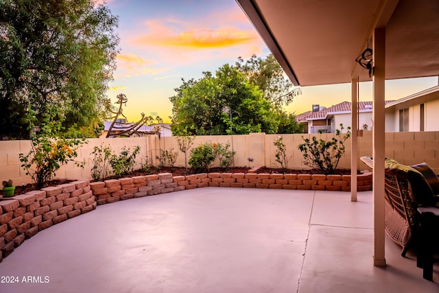 view of patio terrace at dusk