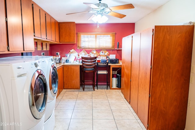 washroom with separate washer and dryer, ceiling fan, light tile patterned floors, and cabinets