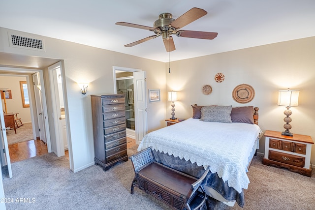 bedroom with ceiling fan and light carpet