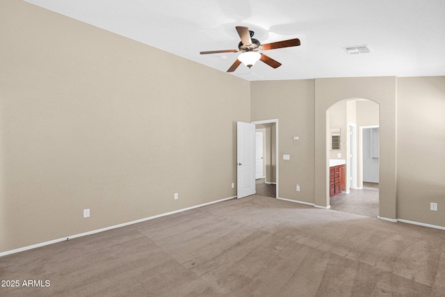 2620 E Rustling Oaks Ln, Phoenix, AZ 85024 - unfurnished bedroom with arched walkways, carpet, baseboards, and lofted ceiling