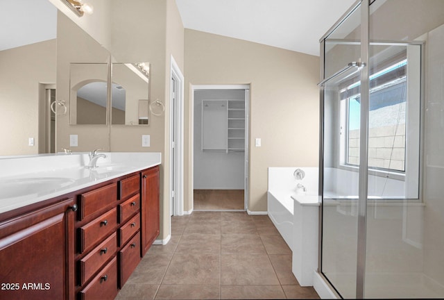 2620 E Rustling Oaks Ln, Phoenix, AZ 85024 - full bath featuring double vanity, a bath, a shower stall, tile patterned floors, and lofted ceiling