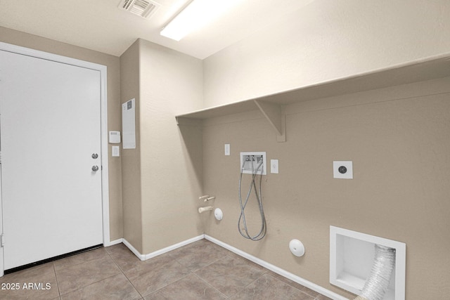 2620 E Rustling Oaks Ln, Phoenix, AZ 85024 - laundry room with gas dryer hookup, hookup for a washing machine, electric dryer hookup, light tile patterned floors, and baseboards