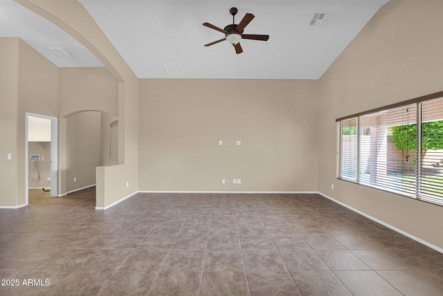 2620 E Rustling Oaks Ln, Phoenix, AZ 85024 - tiled spare room featuring a ceiling fan, high vaulted ceiling, arched walkways, and baseboards
