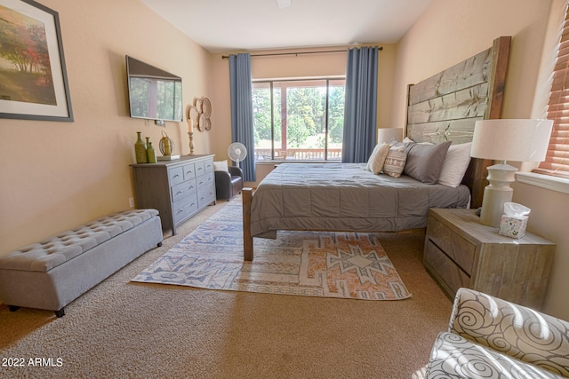 bedroom featuring light carpet