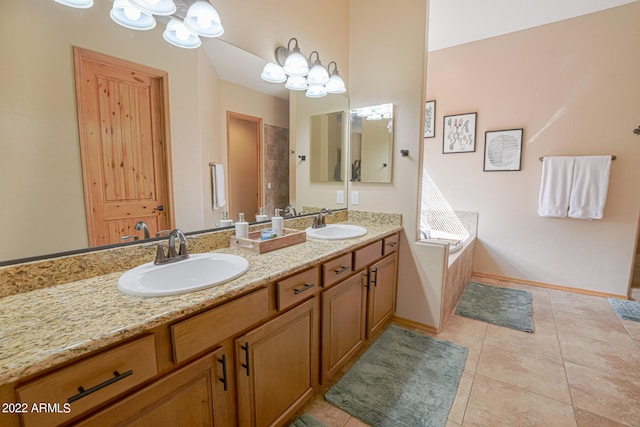 bathroom featuring a bath to relax in, tile floors, and dual bowl vanity