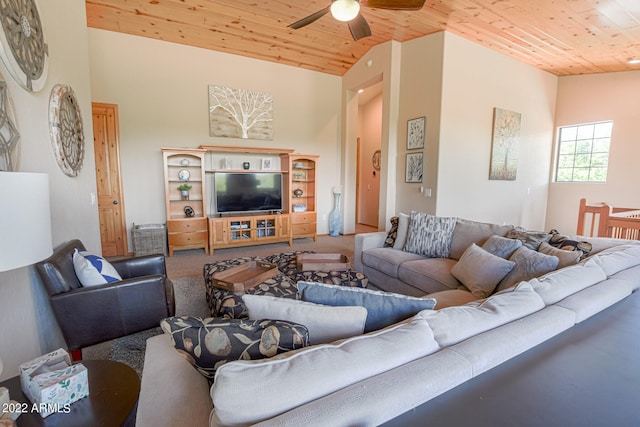 living room with carpet flooring, wood ceiling, and ceiling fan