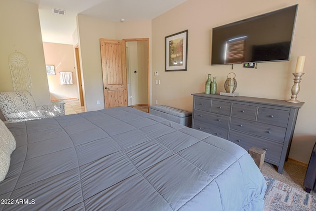 bedroom with light colored carpet