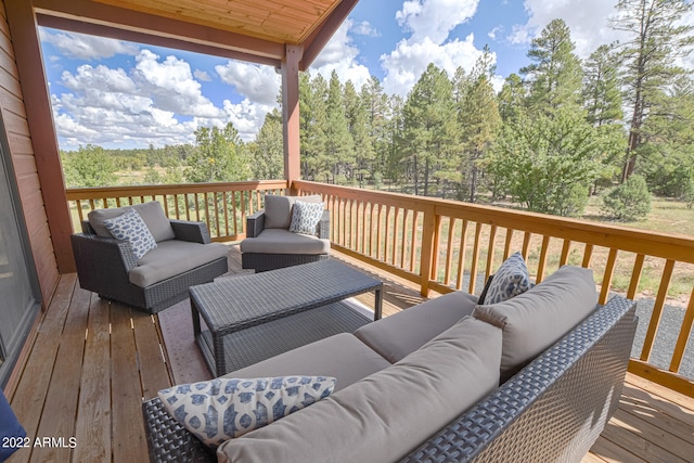 wooden terrace featuring outdoor lounge area