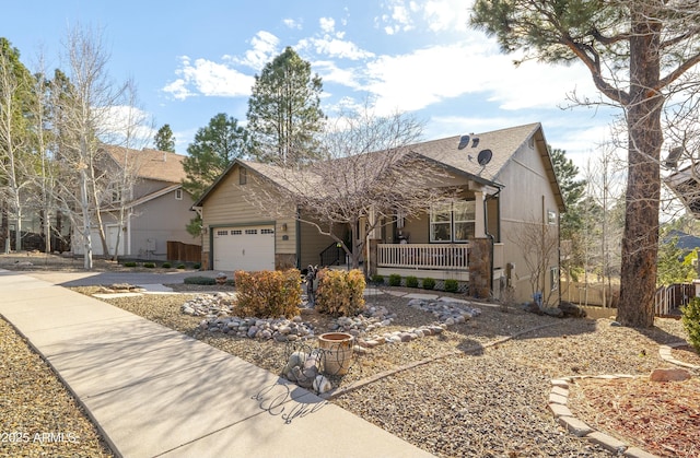view of front facade featuring an attached garage, fence, roof with shingles, a porch, and driveway