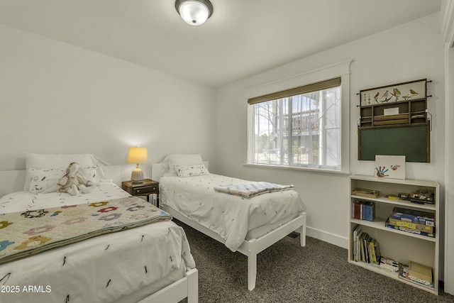carpeted bedroom featuring baseboards