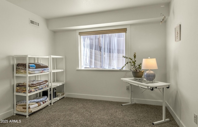 carpeted bedroom with baseboards and visible vents