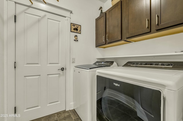 laundry area with washer and dryer and cabinet space
