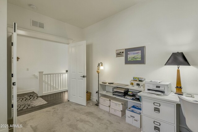 bedroom featuring light colored carpet and visible vents