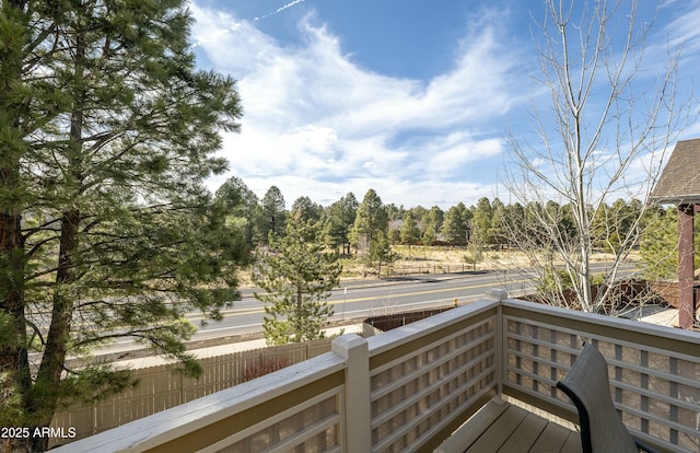 wooden deck featuring fence