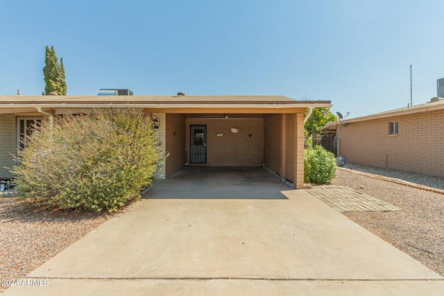 exterior space with a carport