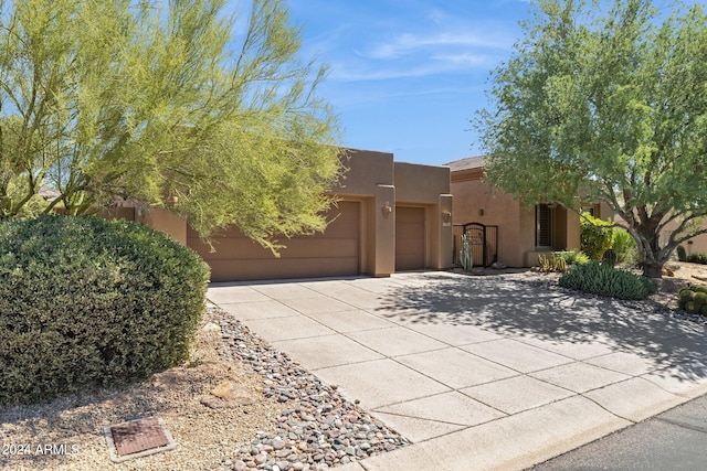 southwest-style home featuring a garage