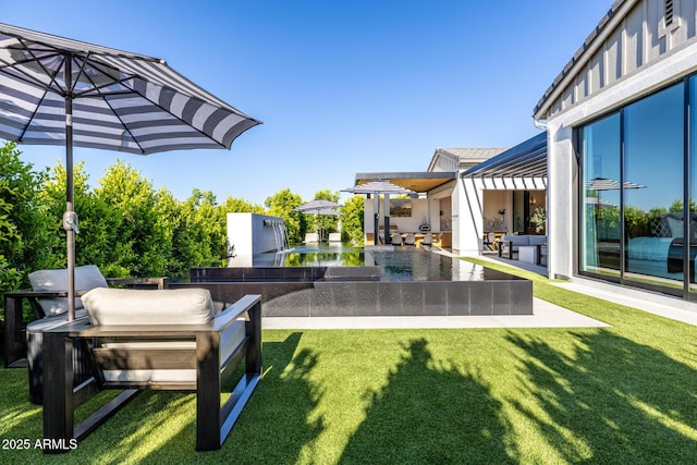 3684 E Boot Track Trl, Gilbert, AZ 85296 - view of grassy yard with an infinity pool and a patio area