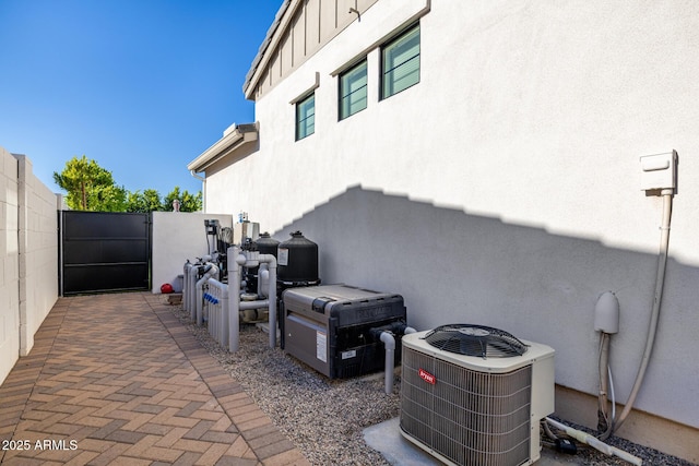 3684 E Boot Track Trl, Gilbert, AZ 85296 - view of patio / terrace with central AC unit and a gate