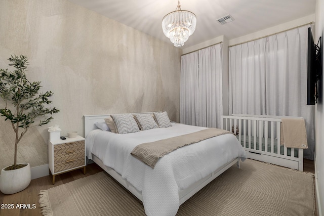 3684 E Boot Track Trl, Gilbert, AZ 85296 - bedroom with wood finished floors, a chandelier, and baseboards
