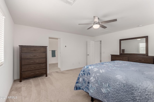 bedroom featuring baseboards, light colored carpet, multiple windows, and visible vents