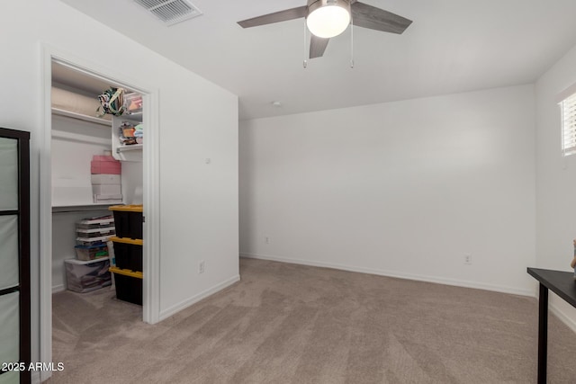 unfurnished bedroom with visible vents, a closet, baseboards, a spacious closet, and carpet