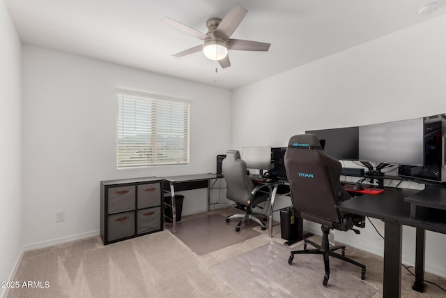 office area with carpet flooring, baseboards, and ceiling fan