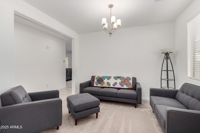 living room featuring light colored carpet, baseboards, a chandelier, and a wealth of natural light