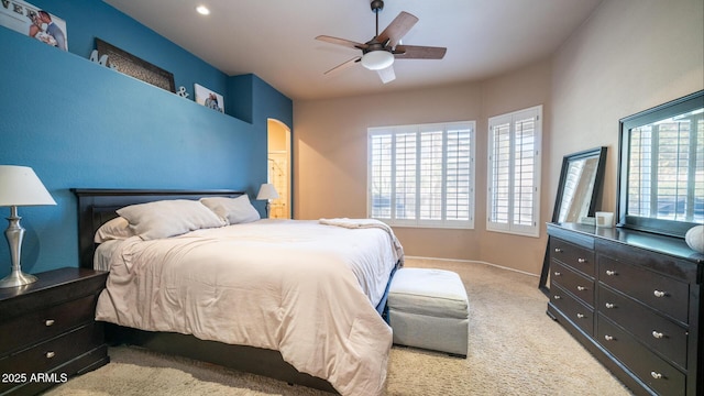 bedroom with light carpet and ceiling fan