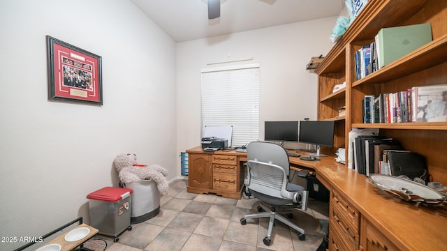 home office featuring light tile patterned floors and ceiling fan