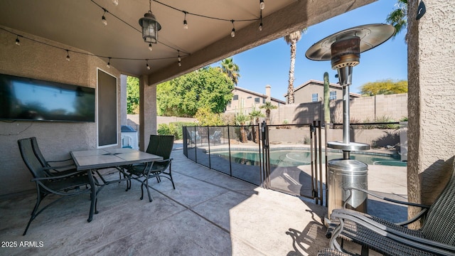 view of patio / terrace with a fenced in pool