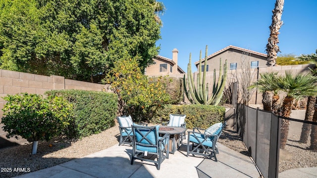 view of patio with a fire pit