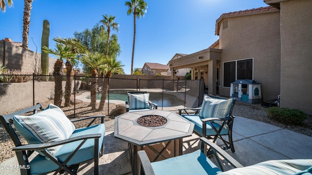 view of patio / terrace featuring a fire pit