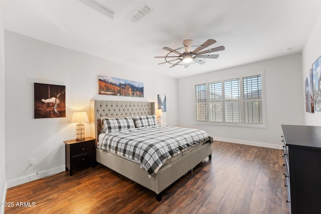 bedroom with dark hardwood / wood-style floors and ceiling fan