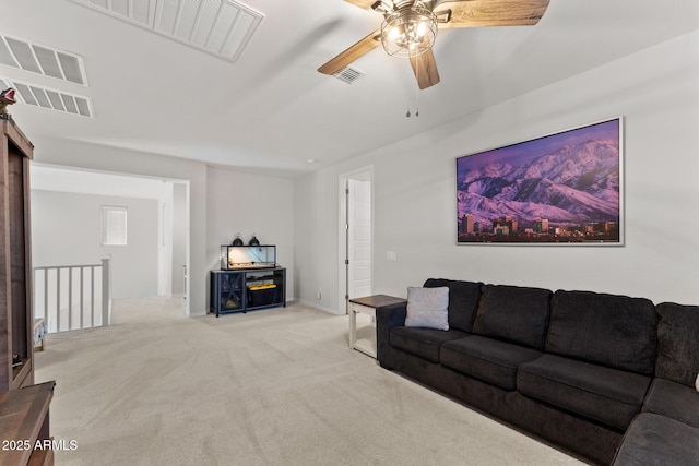 carpeted living room featuring ceiling fan