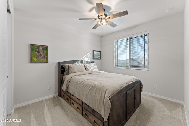 bedroom with light colored carpet and ceiling fan