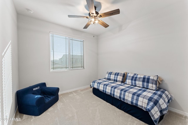 sitting room featuring ceiling fan and carpet flooring