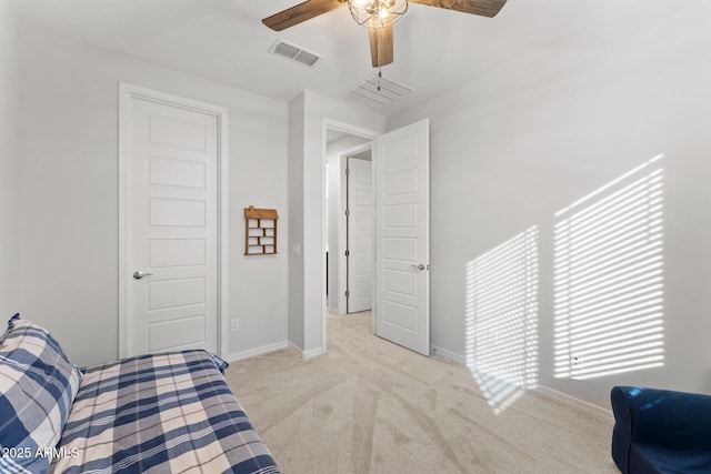 bedroom with light carpet and ceiling fan