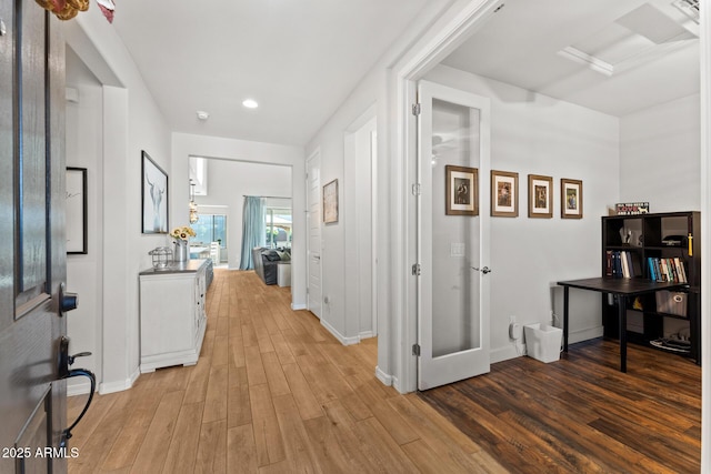 corridor featuring hardwood / wood-style flooring