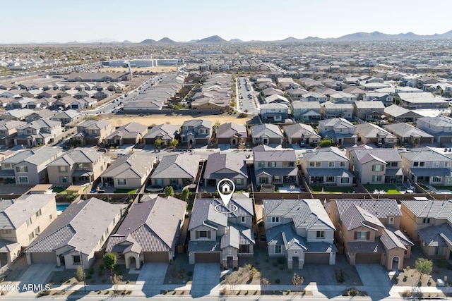 birds eye view of property with a mountain view