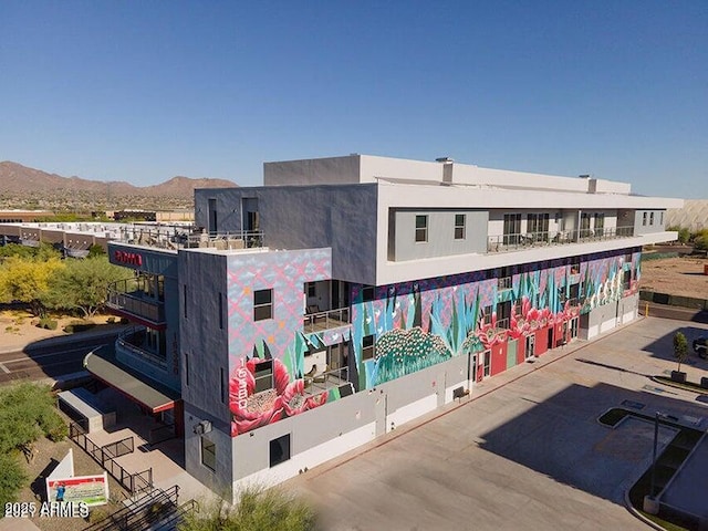 view of building exterior featuring a mountain view