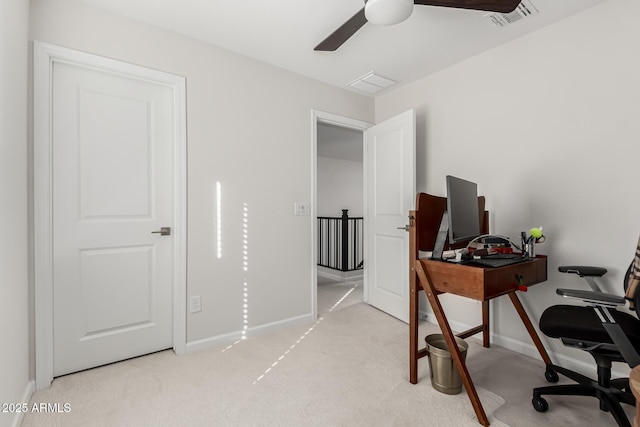 home office with baseboards, a ceiling fan, visible vents, and light colored carpet