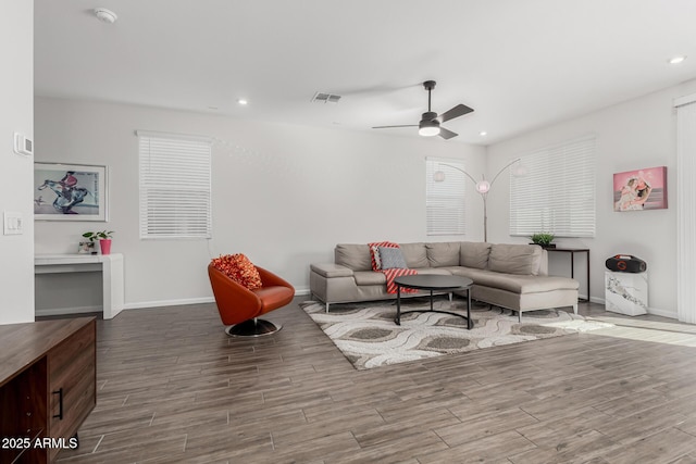 living area featuring ceiling fan, recessed lighting, wood finished floors, visible vents, and baseboards